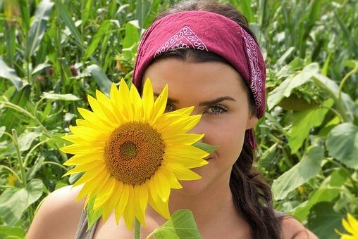 Jennifer Sharpe and a sunflower